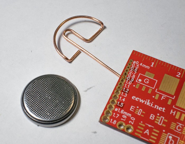 wire bent coin cell battery tray for tindie