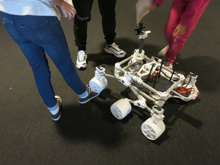 Sawppy at Space Carnival Long Beach running over feet