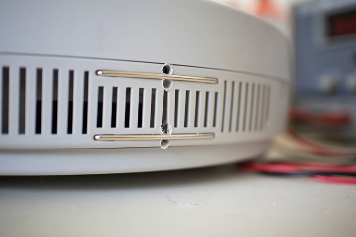 Neato charging experiments drilled holes around contacts