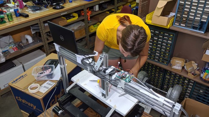 Emily rigging up Sharpie holder for Grbl ESP32 Z axis servo
