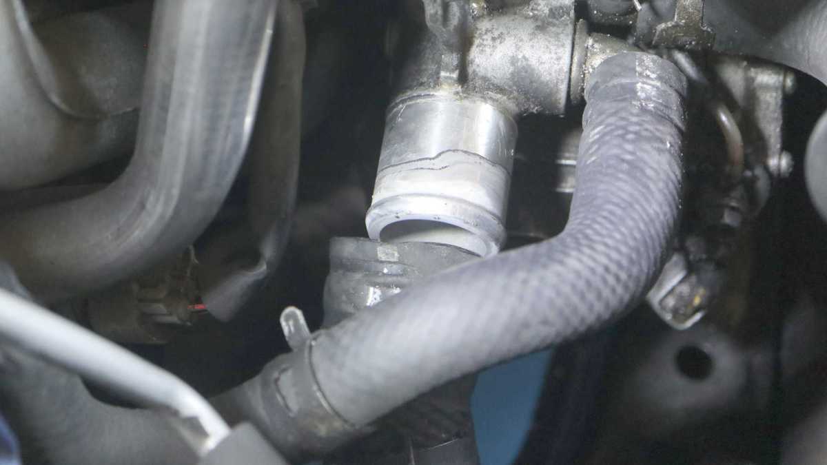 Peeling Old Radiator Hoses Off Fitting – New Screwdriver